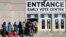 A line of early voters waits outside the Franklin County Board of Elections, Nov. 7, 2016, in Columbus, Ohio. Heavy turnout has caused long lines as voters take advantage of their opportunity to vote before election day.