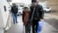 Azerbaijani rights activist Leyla Yunus walks with her husband Arif Yunus after she was released from prison in Baku, Azerbaijan, Dec. 9, 2015.