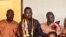 FILE - Uganda's prominent opposition politician Robert Kyagulanyi known as Bobi Wine (2L) appears at the chief magistrate court in Gulu, northern Uganda, on Aug. 23, 2018. 