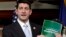 Congresman Paul Ryan holds copy of 2014 Budget Resolution March 12, 2013.