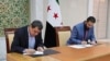 In this photo released by Syrian state news agency SANA, Syria's interim President Ahmad al-Sharaa, right, and Mazloum Abdi, the commander of the U.S.-backed Kurdish-led Syrian Democratic Forces, sign a deal in Damascus, Syria, March 10, 2025.