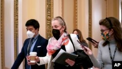 Rep. Abigail Spanberger, D-Va., a key moderate in the Democratic Caucus, arrives as the House considers President Joe Biden's domestic policy package, at the Capitol in Washington, Nov. 5, 2021.