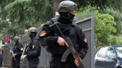 Police officers guard the entrance to the court during the verdict phase of the 2016 failed coup trial, in Podgorica, Montenegro, May 9, 2019.