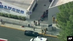 People are lead out of Saugus High School after reports of a shooting, Nov. 14, 2019 in Santa Clarita, California. 