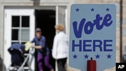 FILE - Voters leave a polling station in Charlotte, North Carolina, May 8, 2018.