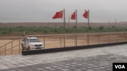 Chinese flags flutter atop the coal-mining site in Islamkot, Tharparkar district, Pakistan.