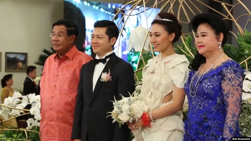 Prime Minister Hun Sen and his wife in picture with Sok Sokan, the son of the late Council of Ministers President Sok An, and Sam Ang Leakhena whose parents own Vattanac Capital on their wedding day in June. (Web Screenshot)