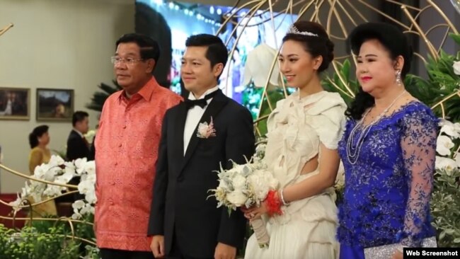 Prime Minister Hun Sen and his wife in picture with Sok Sokan, the son of the late Council of Ministers President Sok An, and Sam Ang Leakhena whose parents own Vattanac Capital on their wedding day in June. (Web Screenshot)