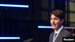 Canada's Prime Minister Justin Trudeau answers questions from the media in Montreal, Quebec, Aug. 8, 2018.