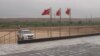 Chinese flags flutter atop the coal-mining site in Islamkot, Tharparkar district, Pakistan.