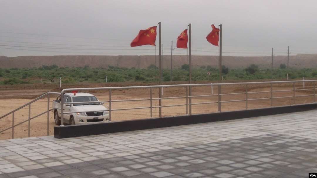 Chinese flags flutter atop the coal-mining site in Islamkot, Tharparkar district, Pakistan.