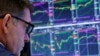 A trader works on the floor of the New York Stock Exchange shortly after the opening bell in New York, June 27, 2017. 