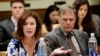 FILE - Fred Warmbier, right, listens as his wife, Cindy Warmbier, speaks of their son Otto Warmbier, an American who died in 2017 days after his release from captivity in North Korea, during a meeting at the United Nations headquarters, May 3, 2018.