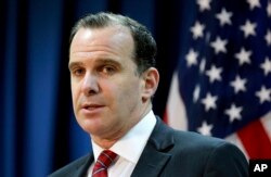 FILE - In this June 7, 2017, photo, Brett McGurk, the U.S. envoy for the global coalition against IS, speaks to reporters at the U.S. Embassy Baghdad, Iraq.