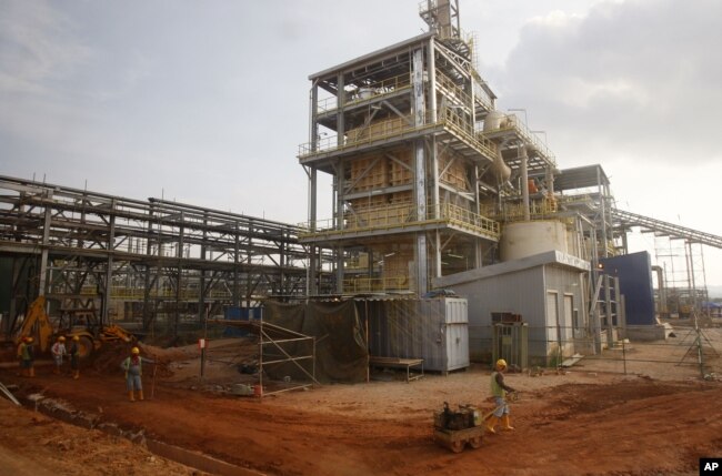 FILE - Workers are pictured at the site of the Lynas rare earth plant in Gebeng, eastern Malaysia, April 19, 2012.