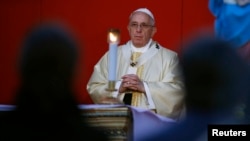 Pope Francis celebrates a mass on All Saints' Day at the Verano cemetery in Rome, Nov. 1, 2014. 