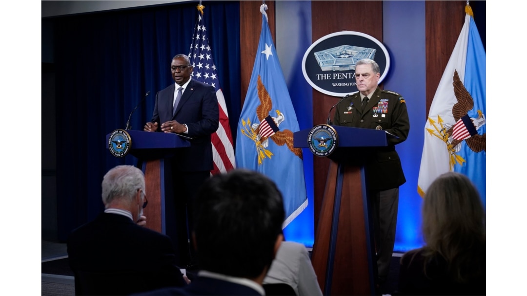 Secretary of Defense Lloyd Austin, left, answers a question during a briefing with Joint Chiefs Chairman Gen. Mark Milley at the Pentagon in Washington, Sept. 1, 2021, about the end of the war in Afghanistan.