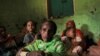 Fatuma Hussein, 65, sits in her shelter with her family at a camp for the internally displaced due to the fighting between the Ethiopian National Defense Force (ENDF) and the Tigray People's Liberation Front (TPLF) forces in Dessie town, Amhara region, Ethiopia, October 8, 2021. 