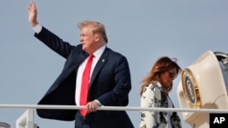 President Donald Trump and first lady Melania Trump board Air Force One, April 18, 2019, at Andrews Air Force Base, Md. 