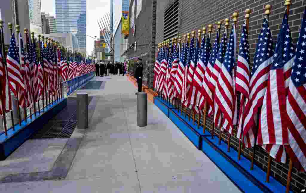 An FDNY firefighter stands as part of an honor guard at the FDNY Memorial Wall near the World Trade Center, Sept. 11, 2016, on the 15th anniversary of the attacks on the World Trade Center in New York.