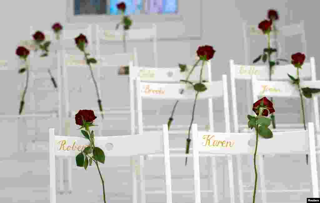 Chairs and roses show where people were found dead at the First Baptist Church of Sutherland Springs, Texas, Nov. 12, 2017.&nbsp; Hundreds of mourners crowded into the tiny town for the first Sunday service since a gunman stormed the church a week earlier, killing more than 26 people in the worst mass shooting in Texas history.