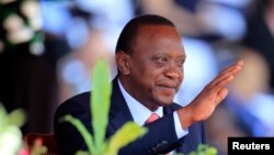 Kenya's President Uhuru Kenyatta reacts as he attends Mashujaa (Heroes) Day at the Nyayo National Stadium in capital Nairobi, Oct. 20, 2013. 