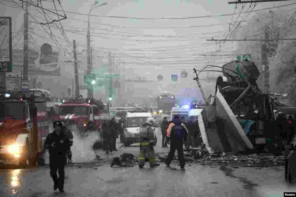 Members of the emergency services work at the site of a bomb blast on a bus in Volgograd, Dec. 30, 2013.