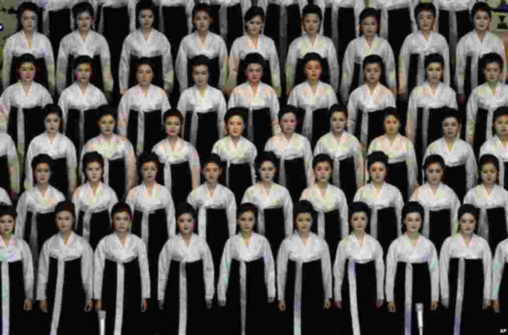 North Korean performers pause before singing at the Pyongyang indoor gymnasium to commemorate late president Kim Il Sung's 100th birthday in Pyongyang, North Korea, Monday, April 16, 2012. (AP Photo/Vincent Yu)