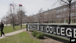 A student walks across campus at Malcom X College, Thursday, April 1, 2010, in Chicago. (AP Photo/M. Spencer Green)