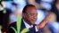 FILE - Kenya's President Uhuru Kenyatta reacts as he attends Mashujaa (Heroes) Day at the Nyayo National Stadium in capital Nairobi, Oct. 20, 2013. 