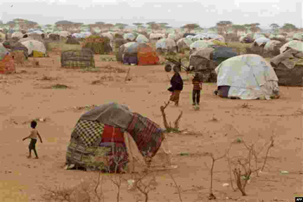 People at a refugee camp in Dadaab, Kenya, Thursday, Aug 4, 2011. Dadaab, a camp designed for 90,000 people now houses around 440,000 refugees. Almost all are from war-ravaged Somalia. Some have been here for more than 20 years, when the country first co