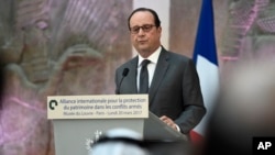 French President Francois Hollande delivers a speech as he participates in the International Donors' Conference for the Protection of Heritage in Armed Conflict at the Louvre Museum in Paris, France, Monday, March 20, 2017.