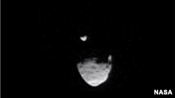 A screenshot shows Martian moon Phobos passing in front of smaller moon, Deimos.