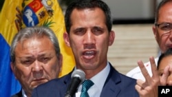 Opposition leader Juan Guaido, who has declared himself the interim president of Venezuela, speaks during a press conference on the steps of the National Assembly in Caracas, Venezuela, Feb. 4, 2019. 