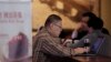 FILE - A man surfs the Internet on his laptop computer at a cafe in Beijing, China, Feb. 16, 2015.