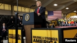 FILE - U.S. President Donald Trump delivers remarks on U.S. infrastructure, in Richfield, Ohio, March 29, 2018. Trump will promote U.S. economic interests when he attends the Summit of the Americas in Lima, Peru, late next week.
