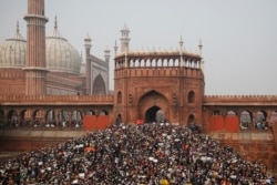 Indians gather for a protest against the Citizenship Amendment Act after Friday prayers outside Jama Masjid in New Delhi, India, Dec. 20, 2019.
