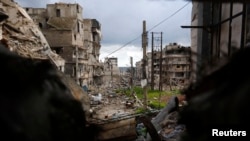 Damaged buildings are seen from a rebel-held area at the al-Amriya front line in Aleppo, Syria, March 3, 2015. 