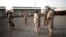 Des soldats de la force conjointe du G5 Sahel assistent à l'inauguration du nouveau quartier général de Bamako le 3 juin 2020.
