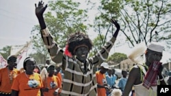 A southern Sudanese man dons traditional tribal accessories during a pro-independence march in the southern capital of Juba, 09 Sept. 2010