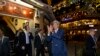 U.S. Secretary of State John Kerry returns a warm greeting from a crowd as he leaves the Foreign Correspondents Club Restaurant in Phnom Penh, Cambodia, Monday, Jan. 25, 2016. Kerry is in Cambodia on the fourth leg of his latest round-the-world diplomatic mission, which will also take him to China. (AP Photo/Jacquelyn Martin, Pool)