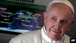 Pope Francis arrives to talk to journalists during his flight from Rome to Panama City, Jan. 23, 2019, where he will attend the World Youth Day.