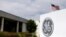 FILE - The logo of Dow Jones Industrial Average stock market index listed company General Electric is shown at their subsidiary company GE Aviation in Santa Ana, California, Apr. 13, 2016.  