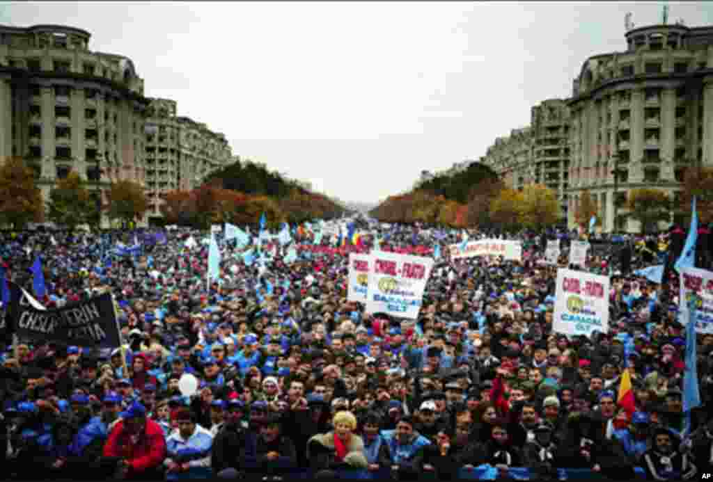 Romanian union members shout anti-government slogans in front of the Romanian Parliament in Bucharest. About 80,000 union members were expected to take part in the demonstration against austerity measures taken by the Romanian government. 