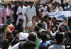 Congress party General Secretary Priyanka Gandhi Vadra meets supporters as she arrives at Assi Ghat in Varanasi, India, March 20, 2019.