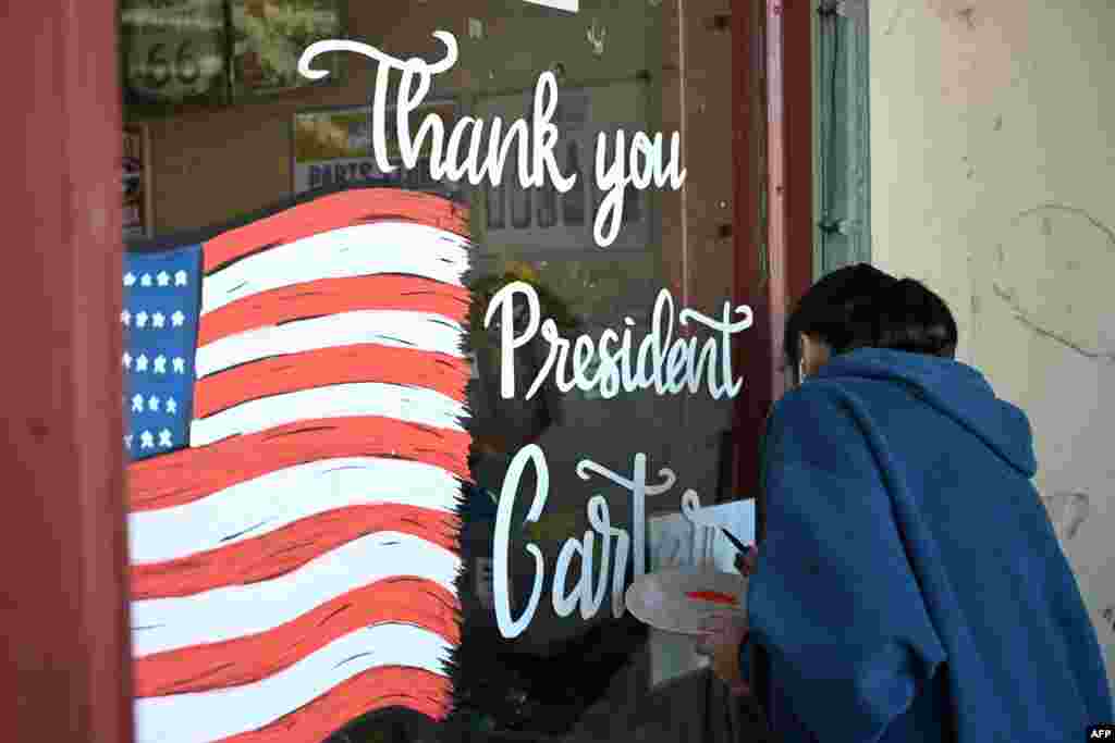 A mural in memory of Jimmy Carter is painted on a storefront at the Jimmy Carter National Historic Park in Plains, Georgia, Dec. 30, 2024.