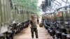 In this file photo taken on June 23, 2010, A Cambodian army soldier looks at Chinese military vehicles displayed before a handover ceremony at a military airbase in Phnom Penh, Cambodia.