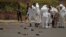 Forensic policemen inspect the site of a suicide bomb attack at a parade square in Sanaa, Yemen, May 21, 2012. 