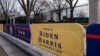 Signs for the inauguration of President-elect Joe Biden stand near the White House in Washington