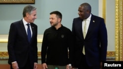 FILE - U.S. Secretary of State Antony Blinken, left, and Britain's Foreign Secretary David Lammy, right, pose for a photo with Ukraine's President Volodymyr Zelenskyy at the Mariinsky Palace in Kyiv, Ukraine, Sept. 11, 2024.